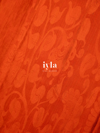 The Divine Drape of Radha Krishna in Burnt Orange
