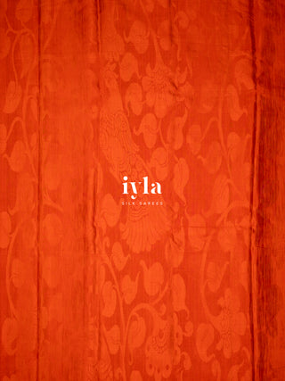 The Divine Drape of Radha Krishna in Burnt Orange